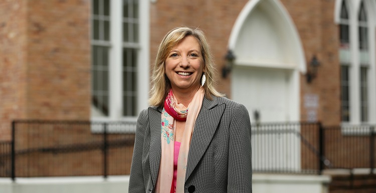 Dr. Kathy J. Cooke, dean of USA's new Honors College standing outside the Bethel Chapel