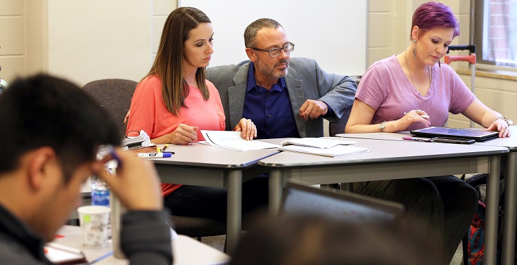 Dr. Craig Pearce, center, is the co-author of the new book “Twisted Leadership” and the Ben May Distinguished Professor in the Mitchell College of Business at the University of South Alabama.