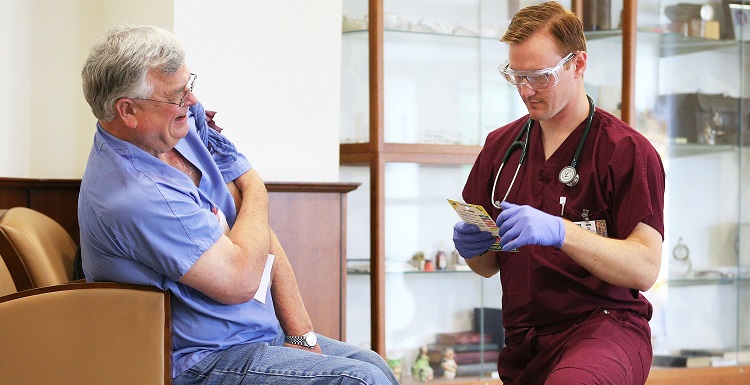 Physician Assistant Student Mason Morris, right, attends to an actor patient during a drill at the University of South Alabama.