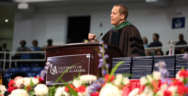 Dr. Tyler Sexton, who completed his residency at the University of South Alabama and is now chair of pediatrics at a Mississippi hospital, spoke to graduates about overcoming obstacles. Sexton was born with cerebral palsy. 