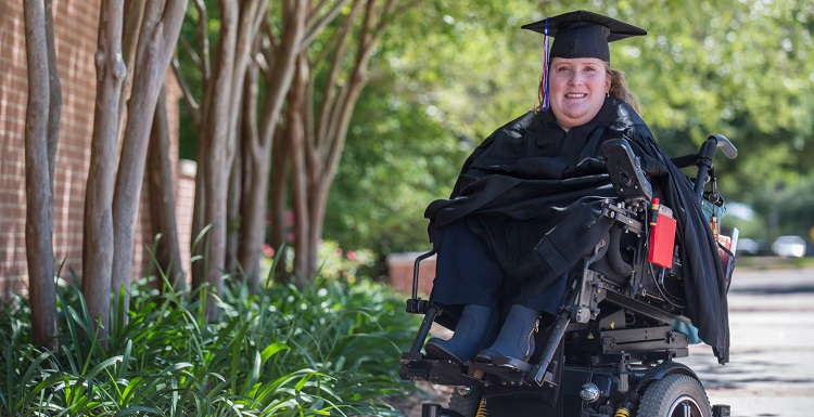 Jennifer Oveson attended the University of South Alabama part-time and overcame obstacles due to spina bifida to earn her bachelor's degree. "Giving up is not an option," her parents told her. 