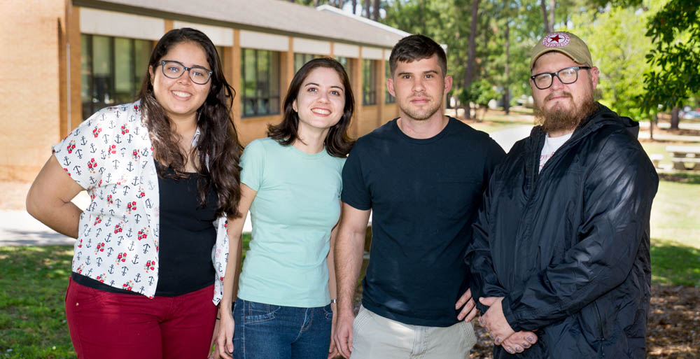 The University of South Alabama is one of only five universities in the United States to participate in a pilot exchange program through the American Association of State Colleges and Universities. From left, Ilza de Oliveira Feitosa Passos and Jéssica Campêlo de Sá visited Mobile for two months, and South students Eric Anderson and Dale Pate will travel to Brazil. data-lightbox='featured'