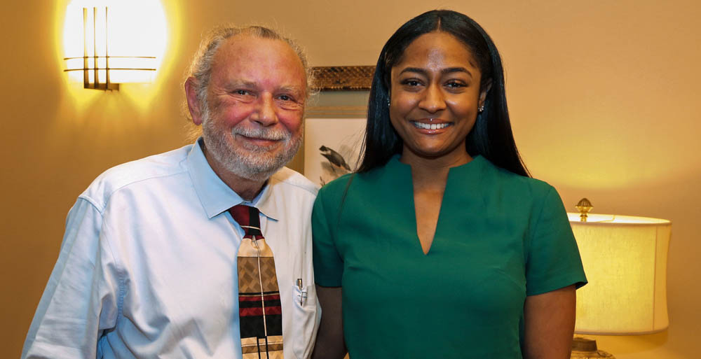 Kourtney McCollum is the first recipient of the Hansen and Aucoin Journalism Scholarship. McCollum is congratulated by Dr. Jim Aucoin.