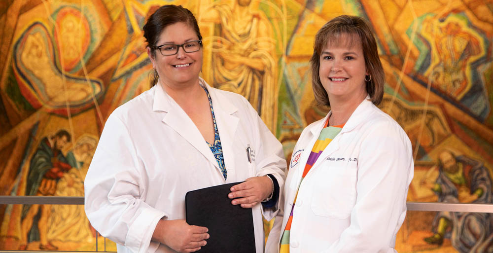 Dr. Karen Fagan, left, director of USA Health’s pulmonary and critical care division, and Dr. Natalie Bauer, an associate professor of pharmacology at USA, are two of the more than 40 faculty members who work with the USA Center for Lung Biology. “I couldn’t move my work forward in this way without collaborating the way I have with Dr. Fagan, and that’s why I think the USA Center for Lung Biology provides an excellent environment for practicing translational medicine,” Bauer said. 