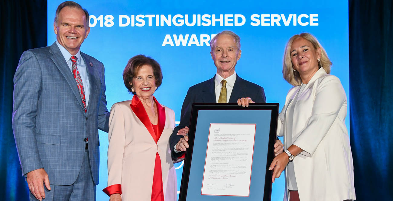 Arlene Mitchell, center left, and Abraham “Abe” Mitchell, center right, were recognized, along with the late Mayer Mitchell, for their philanthropy during a Monday awards ceremony by the Council for Advancement and Support of Education. On stage with them are James T. Harris, president of the University of San Diego and chair of the CASE Board of Trustees, and Sue Cunningham, president and CEO of CASE.