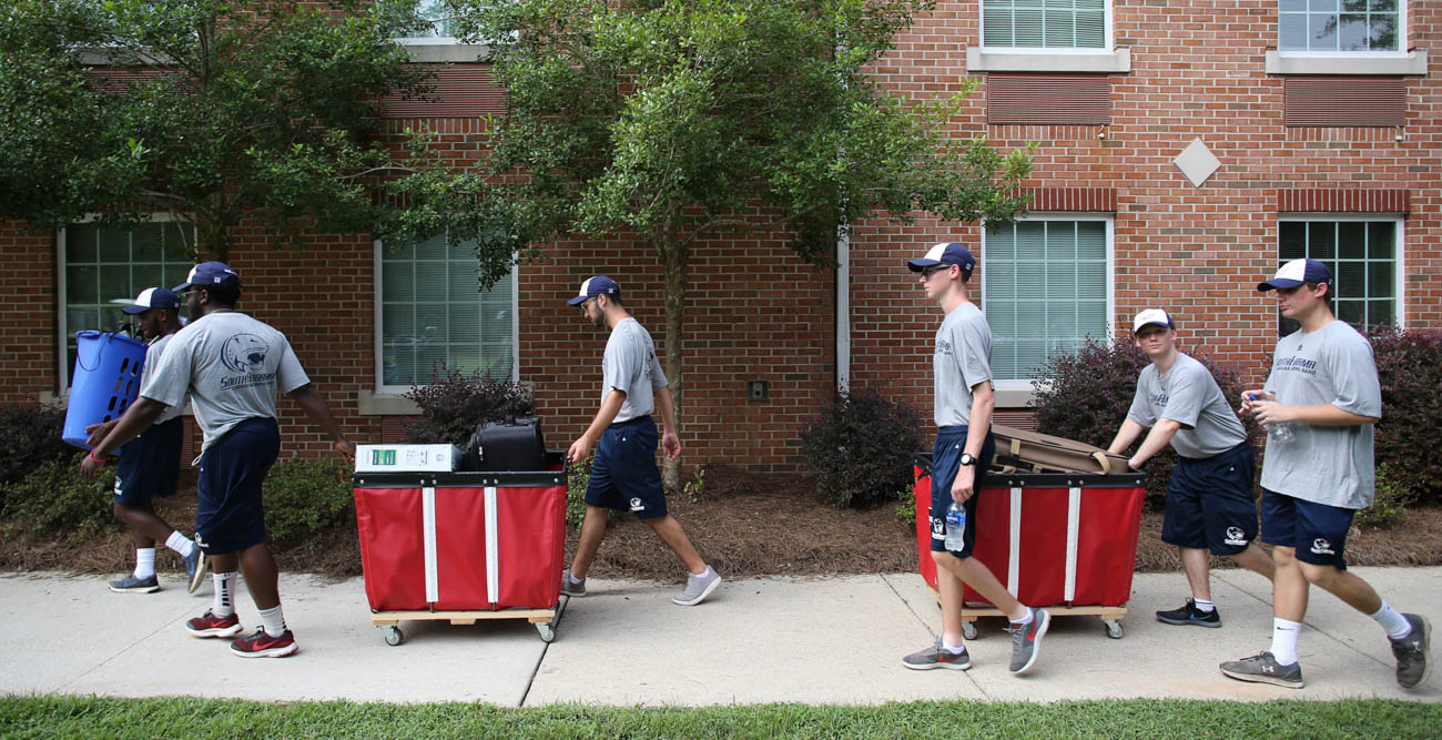 Members of the Jaguar Marching Band were among the students, faculty and staff who helped freshmen move in to their on-campus homes. Here they are in front of Epsilon Hall. data-lightbox='featured'