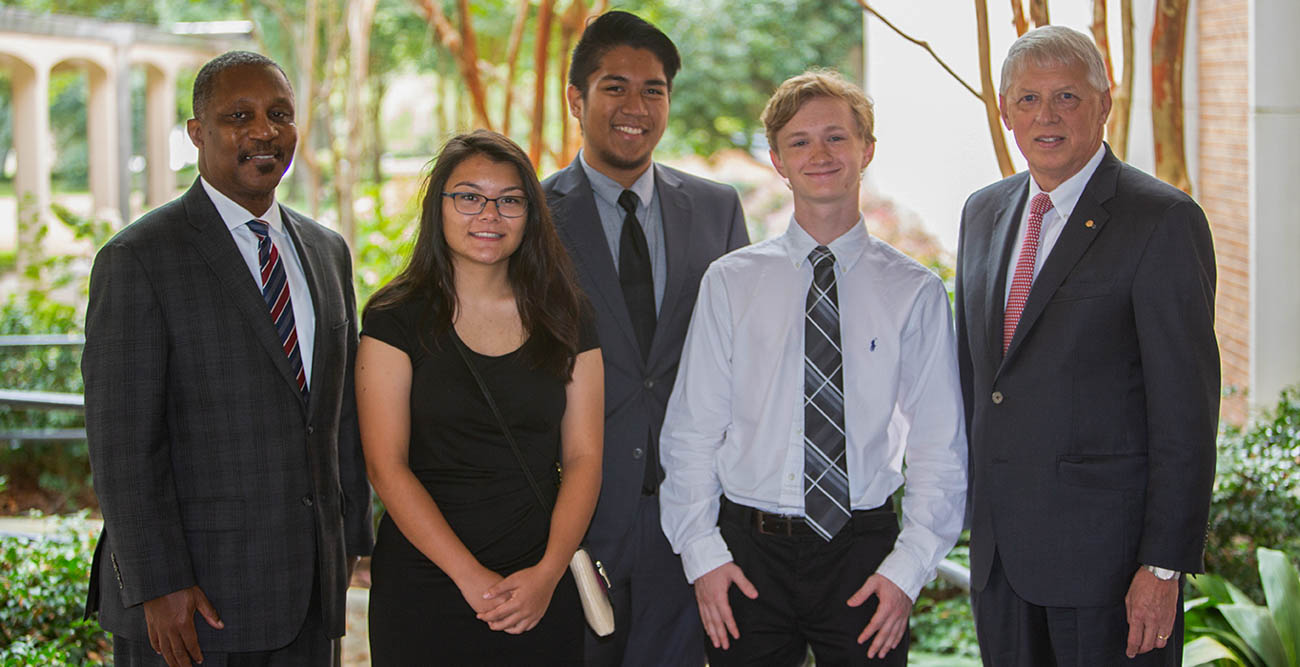 Board of Trustees Chair Pro Tempore Ken Simon, far left, along with other trustees recognized the 2018 Board of Trustees Scholar Cody Dunlap, second from right, at their fall meeting. Also attending were, from left, Ada Chaeli van der Zijp-Tan, 2017 recipient; Christian Manganti, 2016 recipient; and Dr. Tony Waldrop, University president. 