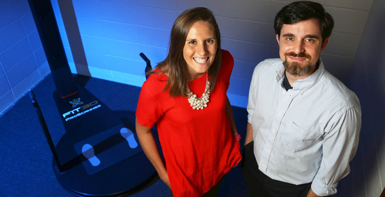 Dr. Caitlyn Hauff, assistant professor of kinesiology and health promotion, and Dr. Geoffrey Hudson, an assistant professor of exercise science, are two of a dozen members of South's Obesity Research Network. Hudson is testing whether a 3D camera, in the background, can accurately measure body fat. Hauff specializes in body image and weight stigma research.