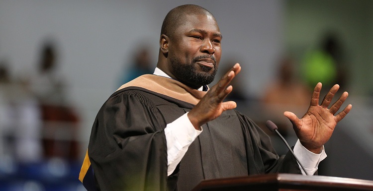 Ovie Mughelli, an environmental advocate and former NFL fullback, told graduates that "what you do has to be about more than a job, more than a paycheck. Your purpose in life is inside you." data-lightbox='featured'