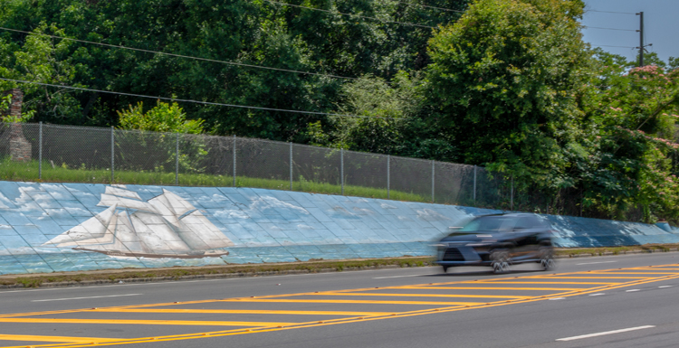 A mural of the Clotilda is painted along Bay Bridge Road in Mobile's Africatown community. 