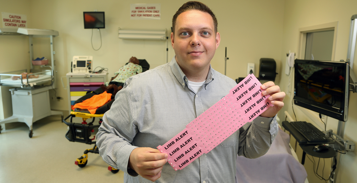 Tyler Sturdivant, alumnus and instructor in the College of Nursing, is giving back by helping to improve health care for patients. He helped start a color-coded wristband initiative at USA Health University Hospital. data-lightbox='featured'