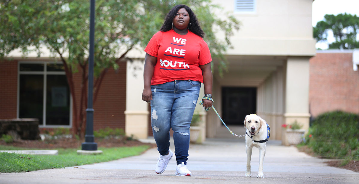 Kearria Freed, a transfer student pursuing a degree in interdisciplinary studies, uses Darling, her 2-year-old Labrador/Golden Retriever service dog, to navigate South's campus. "What I love most about Darling is that she doesn’t judge me because of my disability. Instead, she gives me unconditional love and affection," Freed said.