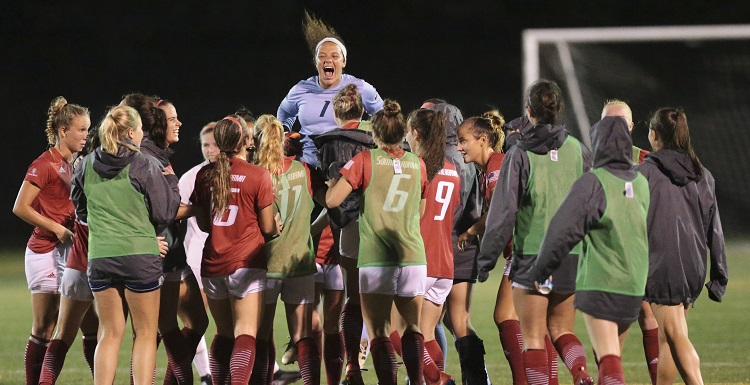 The University of South Alabama soccer team celebrates after a 1-0 win against the Appalachian State Mountaineers to win a fifth Sun Belt Conference title in six years.
