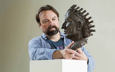 Fernando Guérard with an unfinished cold-cast version of his Chief Calvin McGhee bust.