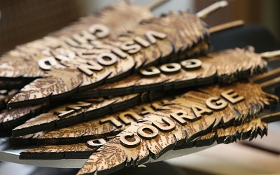 Feathers representing "Courage," "Freedom” and “Respect” were created for the headdress. 