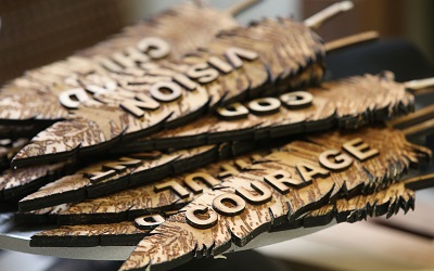 Feathers representing "Courage," "Freedom” and “Respect” were created for the headdress.