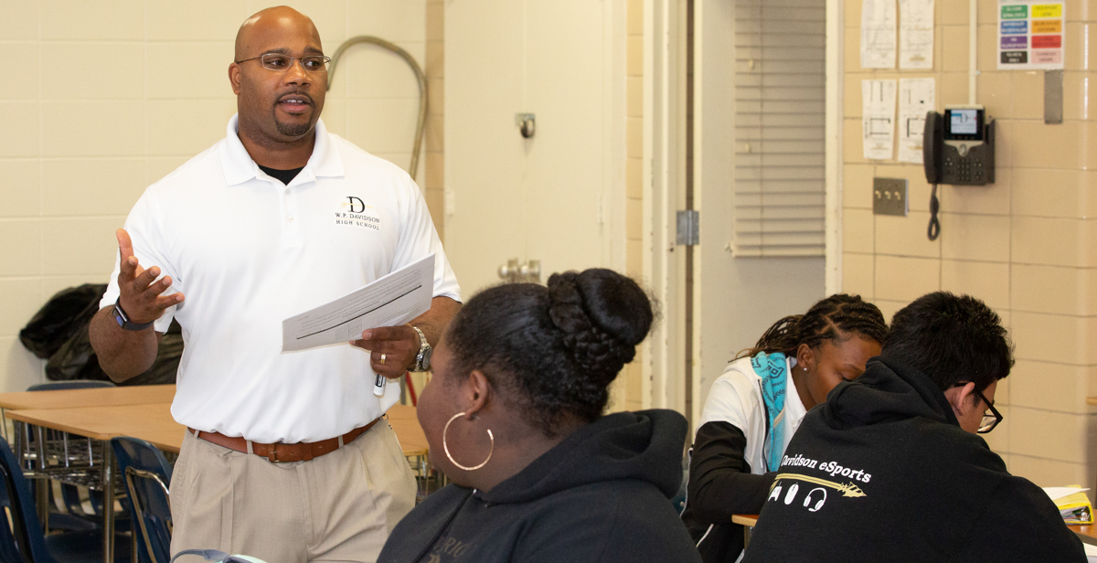 Ramsey Willis instructs students during a geometry class at Davidson High School in Mobile. Willis majored in business and worked in industry prior to completing his master’s degree in education from South through the Robert Noyce Teacher Scholarship Program.