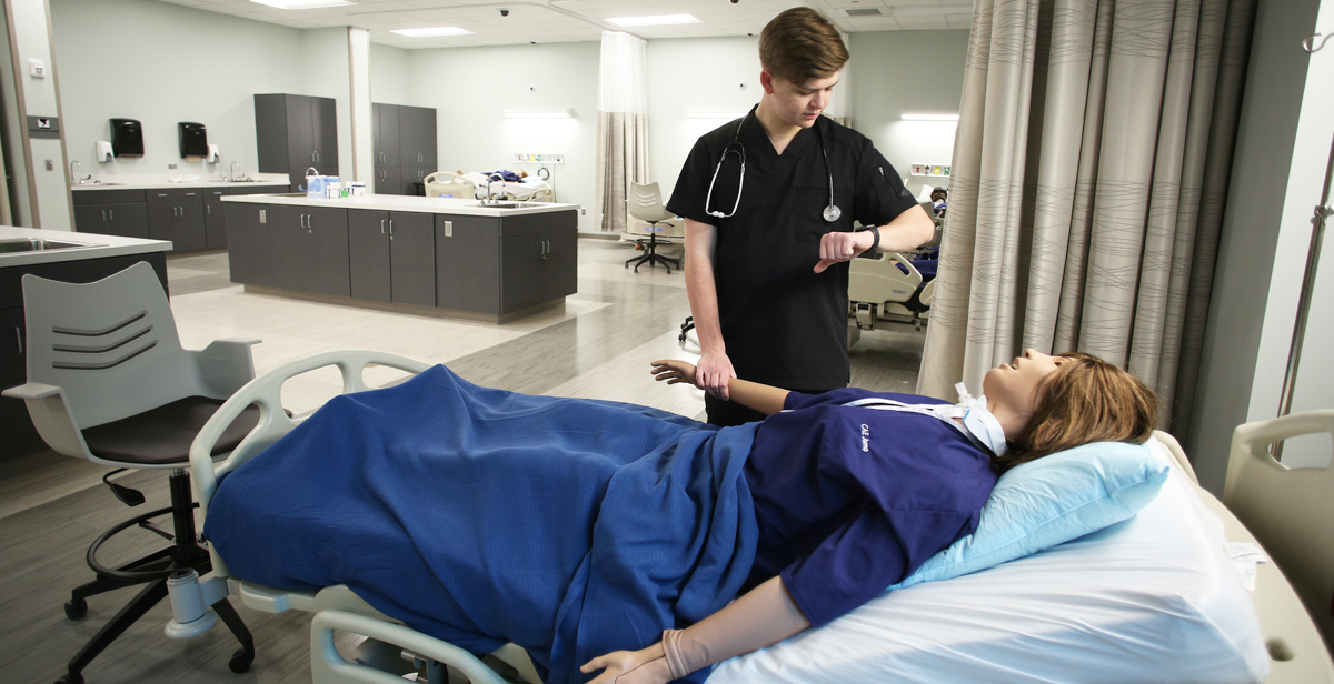 Will Rayner, a professional health sciences major from Hoover, Ala., practices on one of the high-tech patient simulators in the new, 39,000-square-foot Simulation Building. The facility is used by South's nursing, allied health and medical students. 