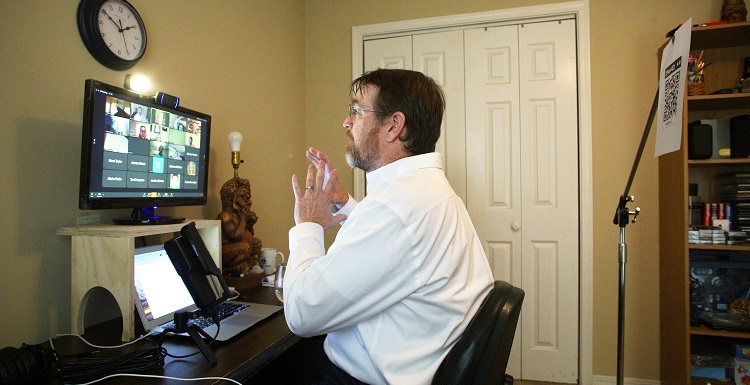 Dr. Joe Gaston, University of South Alabama assistant professor of educational media and technology, demonstrates how to prepare online classes, including the use of QR codes so students can scan and access audio and video lessons. 