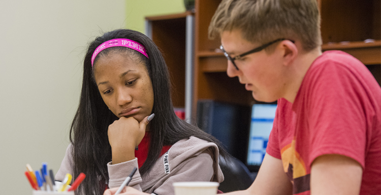 South student receives tutoring at USA's Center for Academic Excellence.