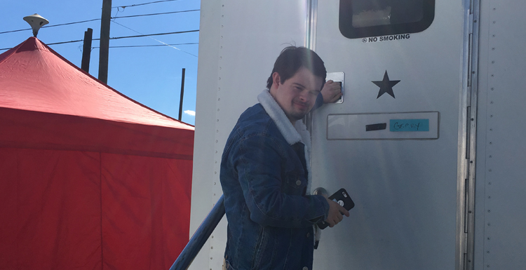 Former South student Benjamin Pelham outside of his trailer on the set of the film "Embattled."