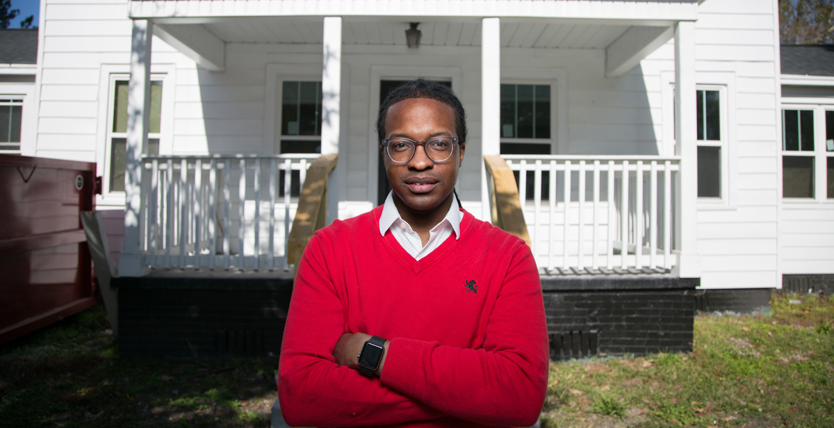 Terrance Smith stands in front of a house on Virginia Street that's being renovated through the work of the Mobile Innovation Team, led by Smith. The home at one point was used by Mobile's Pollman family as a kitchen for their bakery before opening the nearby Pollman's Bake Shop, said Smith, a two time University of South Alabama graduate. data-lightbox='featured'