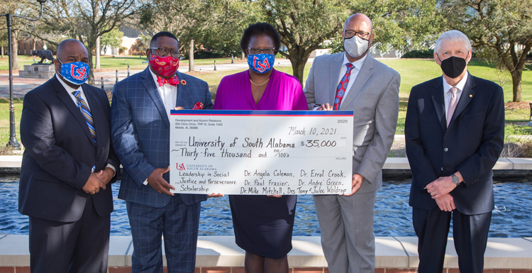 USA administrators present a check for the Leadership in Social Justice and Perserverance scholarship. Left to right: Dr. Andre Green, Dr. Paul Frazier, Dr. Angela Coleman, Dr. Mike Mitchell and USA President Dr. Tony Waldrop.