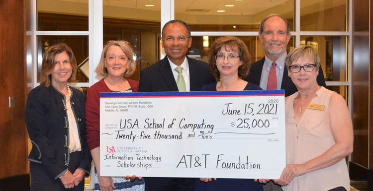 The AT&T Foundation donates $25,000 for the AT&T Aspiring Leaders in Information Technology scholarships. From left; Margaret M. Sullivan, V.P. Development & Alumni Relations; Lori Harris, development officer, School of Computing; Glyn Agnew, regional director, AT&T Alabama; Angela Clark, chair, department of Information Systems & Technology; Dr. Alec Yasinsac, dean, School of Computing; Melissa Smith, senior instructor & recruiting coordinator, department of Information Systems & Technology.