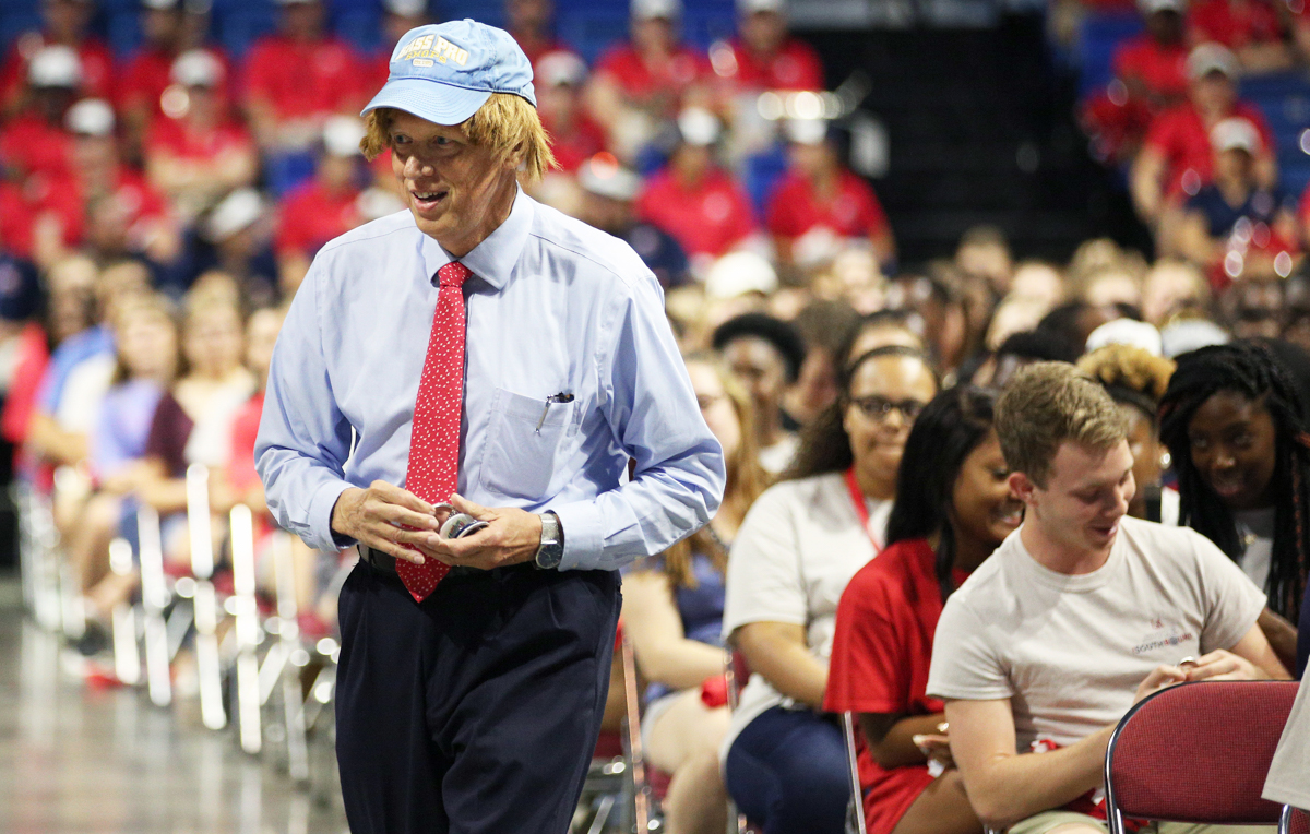 Dr. Tony Waldrop, dressed from a scene in a fictional "Undercover President" episode, greets students at Convocation, part of the annual Week of Welcome. 