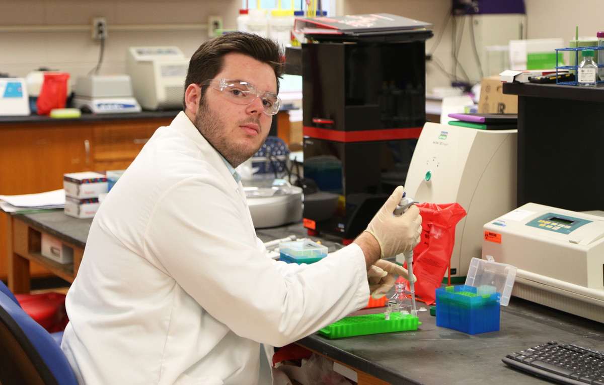 Ian Singley, a biomedical sciences major, is researching the use of bark extract to reduce soreness and inflammation after exercise. 