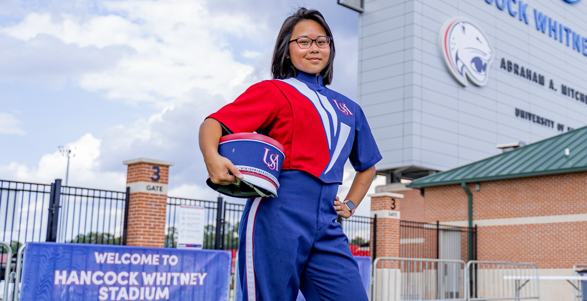 Anita Nguyen, an Honors College freshman, says a lot goes into an on-field marching band routine. The experience is energizing.  data-lightbox='featured'