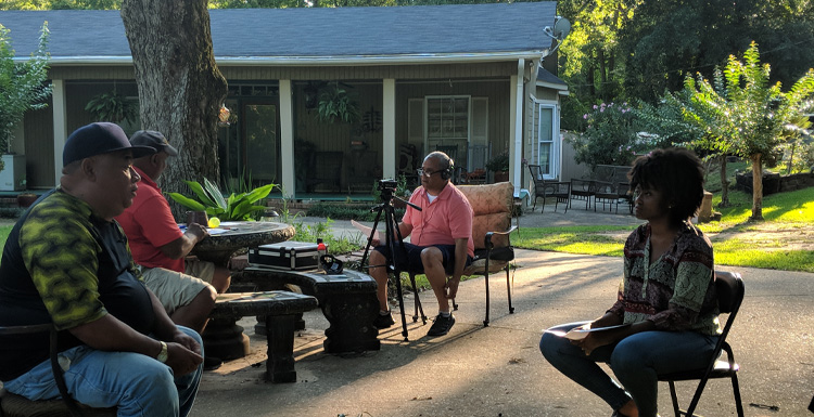 From L-R, Paul Sledge and Delmas McCryndle are interviewed by Dr. Kern Jackson and USA student Ruby Staten about growing up on the Five Rivers delta. A $453,000 grant from the National Endowment for the Humanities will help make interviews like this one available to the general public. At the same time, create a structure for courses and internships through which students and faculty can continue to build relationships with the community through oral history.