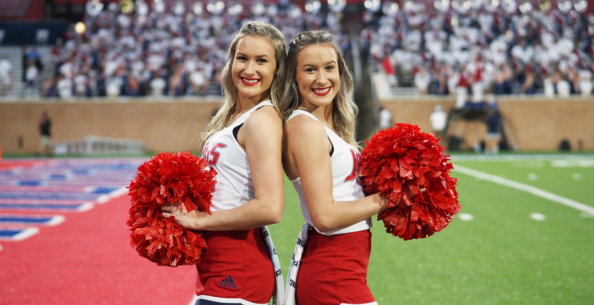 Logan, left, and Mallorie Collins, twin sisters from Satsuma, Alabama, share a residence hall suite, a major in mechanical engineering and a spirit for cheering on the Jaguars.