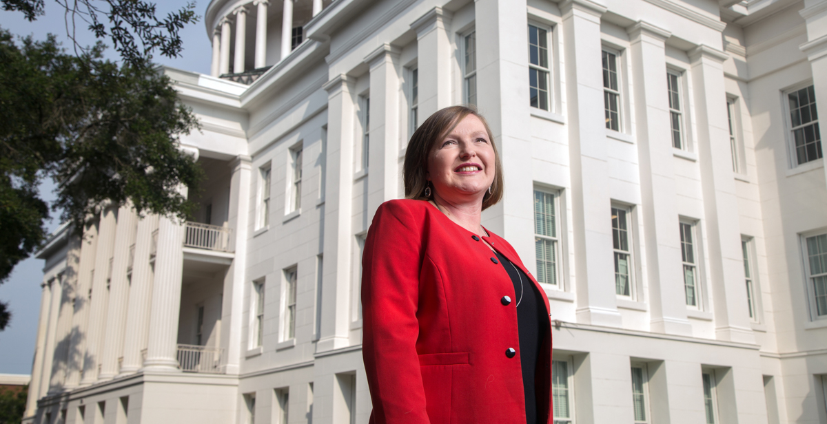 Barton Academy Principal Amanda Jones, a University of South Alabama graduate, stands in front of the new magnet school. 