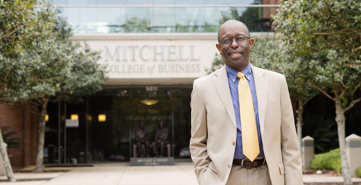 Dr. Alvin Willams, interim dean of the Mitchell College of Business, stands in front of the college.  data-lightbox='featured'