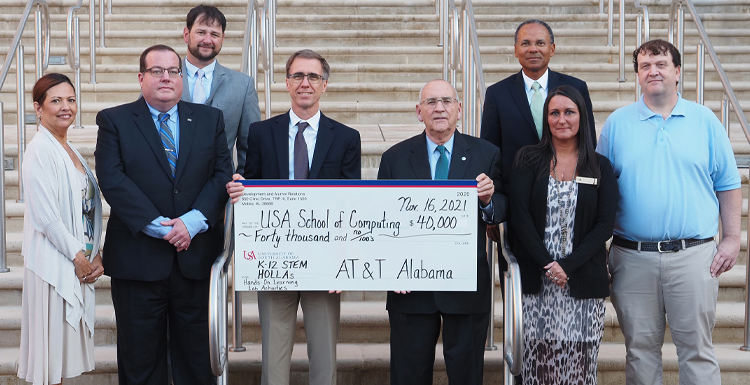 AT&T Alabama contributed $40,000 to support K-12 STEM Hands-On Learning Lab Activities at USA. From left, front row - Lizbeth Stanton, fiber executive, gulf coast region, AT&T; Chris Pennington, southeast regional sales manager, AT&T; Dr. Harold Pardue, interim dean, School of Computing; C. Wayne Hutchens, state president AT&T Alabama; Nikki Donald, CFITS outreach coordinator, School of Computing; Keith Lynn, systems administrator, School of Computing; back row - Matt Coker, client solutions executive II, state of Alabama, AT&T; Glyn Agnew, regional director AT&T Alabama legislative & external affairs.
Photo credit: Mike Kittrell data-lightbox='featured'