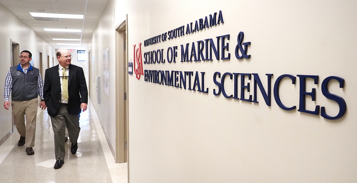 Dr. Sean Powers, right, professor and director of the School of Marine and Environmental Sciences, walks the halls of the school's renovated 20,000-square-foot campus facility at its dedication last year. data-lightbox='featured'