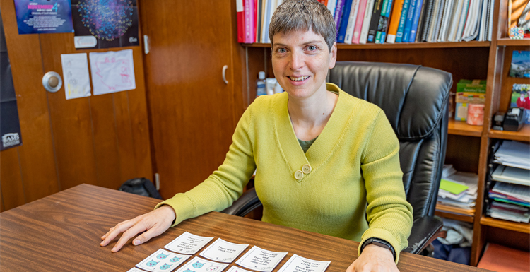 Dr. Elena Pavelescu shows the logic activity she created called "A Game of Cats" that was awarded the third place Rosenthal Prize. Sponsored by the National Museum of Math, the Rosenthal Prize recognizes the most innovative math educators from around the world who are creating engaging, hands-on lesson plans for elementary and middle school students. 