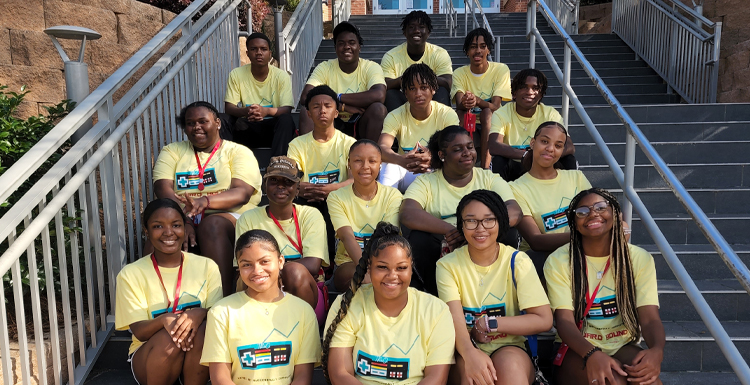 Members of the 2022 Upward Bound program outside of South's dining hall. Students spend six weeks living on campus and have full use of the facilities that traditional USA students utilize.