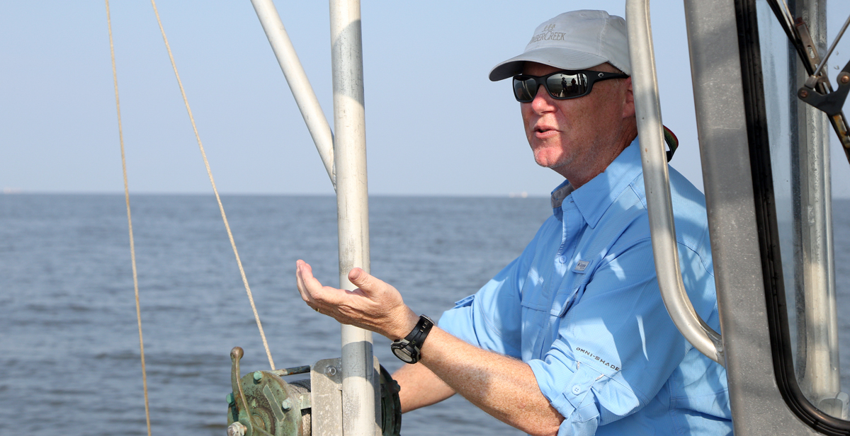 Professor of Marine Sciences Dr. John Lehrter, on a vessel off the Alabama coast in 2021, is leading a study to arrive at a baseline for water and sediment quality in the area. “At a really fundamental level, this project is about going out, very frequently, and trying to get the pulse of state water quality. Where are the places we have to worry about, and what are the places that have good quality?” data-lightbox='featured'