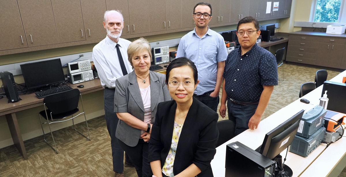 Dr. Na Gong, front, is leading an artificial intelligence research team in a $6 million National Science Foundation project. Her South colleagues in the program include, left to right, Dr. Clive Woods, Dr. Hulya Kirkici, Dr. Mohamed Shaban and Dr. Jinhui Wang.