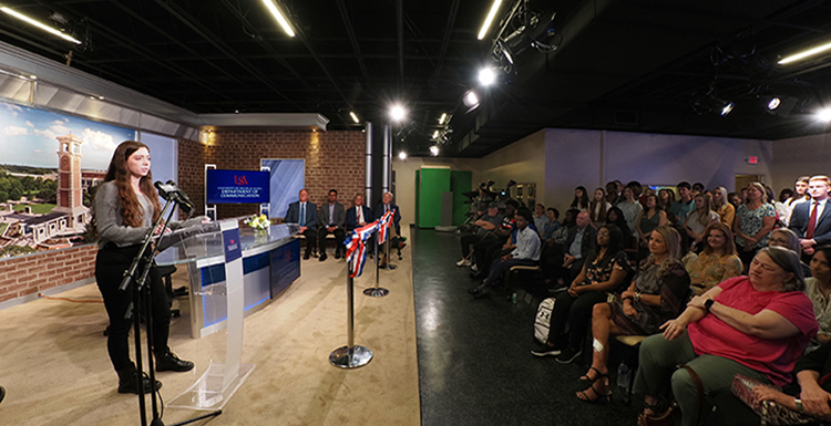 Morgan Brobston, a communication student at the University of South Alabama and manager of JagTV, gives a speech at today’s ribbon cutting ceremony for South’s newly renovated television production studio. 