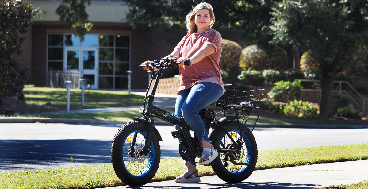 At the University of South Alabama, where she is a freshman, Claudia Allday is studying nursing and travels campus on an electric bicycle.