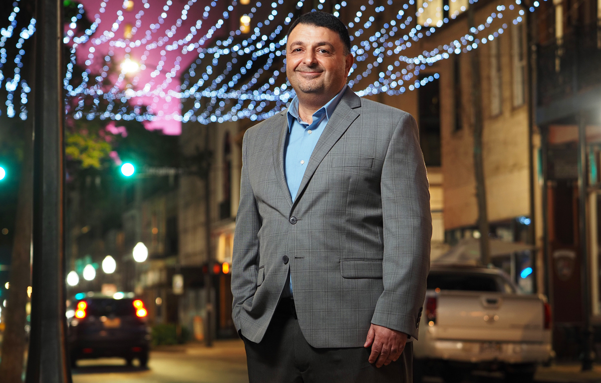 Dr. Khaldoon Nusair, the new department head for Hospitality and Tourism Management at the University of South Alabama, said the future of South's program includes specializations in the major. Here, Nusair stands in the middle of downtown Mobile's entertainment district – a popular draw for both locals and tourists with restaurants, music and event venues, and lodging.