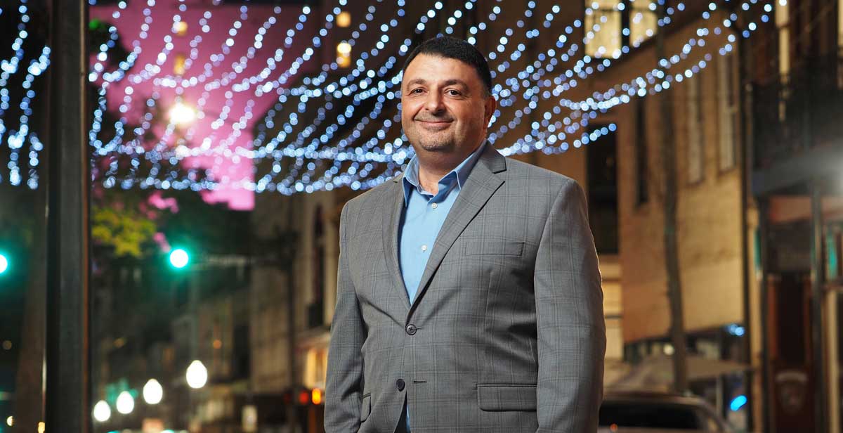 Dr. Khaldoon Nusair, the new department head for Hospitality and Tourism Management at the University of South Alabama, said the future of South's program includes specializations in the major. Here, Nusair stands in the middle of downtown Mobile's entertainment district – a popular draw for both locals and tourists with restaurants, music and event venues, and lodging.