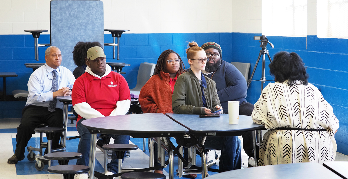 USA Director of African American Studies Dr. Kern Jackson, left, supports his students as they learn through listening in Africatown at the Fifth Annual Spirit of Our Ancestors Festival earlier this month.