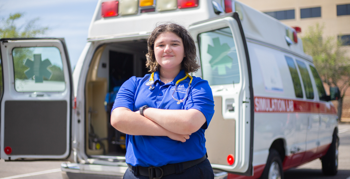 Chloé Knippers works part-time for a Mobile ambulance company. Here, she is in front of the University of South Alabama's Mobile Simulation Lab.  data-lightbox='featured'
