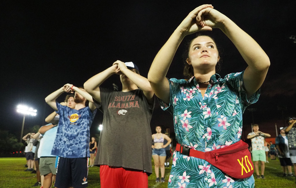 Lindsey Hawkins, right, is a section leader. During Band Camp, some drills are learned without instruments.