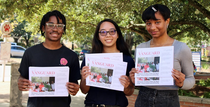 With print editions of The Vanguard student newspaper are, from left, Brandon Clark, managing editor; Stephanie Huynh, editor-in-chief; and Iman Thibodeaux, contributing writer. data-lightbox='featured'