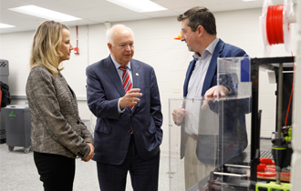 USA president Jo Bonner, executive vice president Dr. Andi Kent and Dr. Matt Reichert discuss the merits of South's new 3D lab.